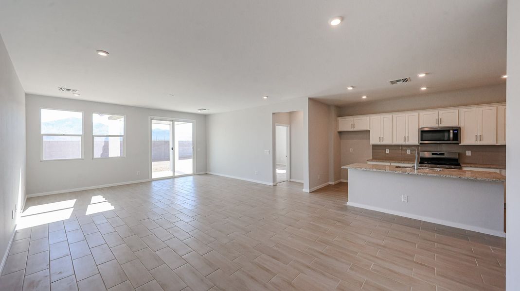 A large kitchen with white cabinets. A large kitchen with white cabinets.