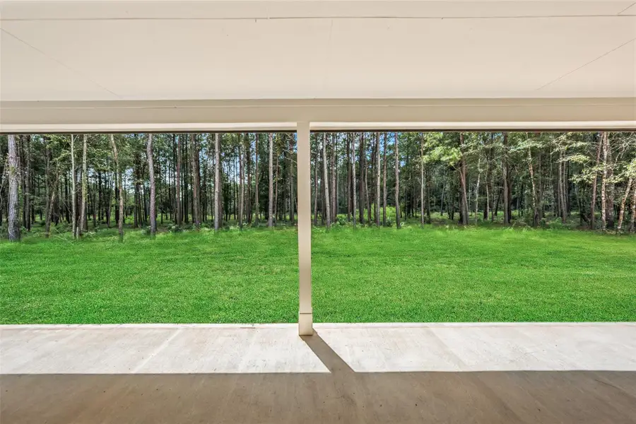 Exterior details and patio area of a home in Deer Pines, Conroe (Image 3).
