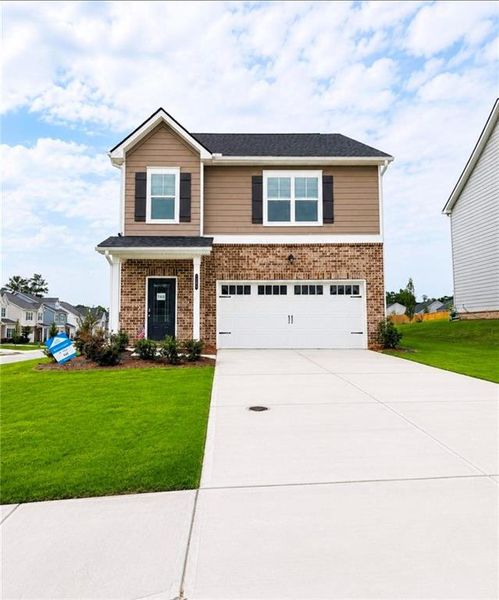 Front exterior of a new home in Neely Farm, Covington, GA, highlighting curb appeal (Image 2). Front exterior of a new home in Neely Farm, Covington, GA, highlighting curb appeal (Image 2).
