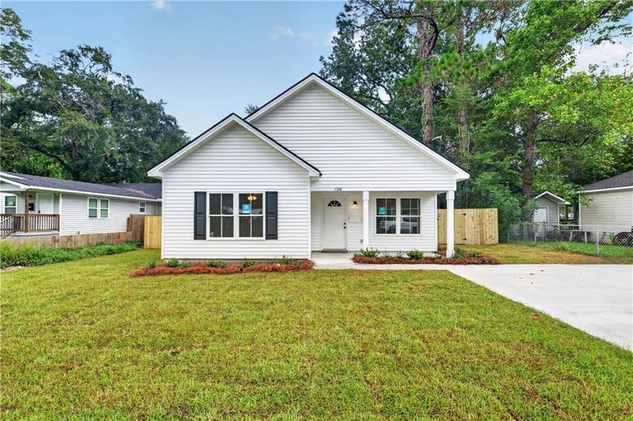 Front exterior of a new home in , Savannah, GA, highlighting curb appeal (Image 1). Front exterior of a new home in , Savannah, GA, highlighting curb appeal (Image 1).