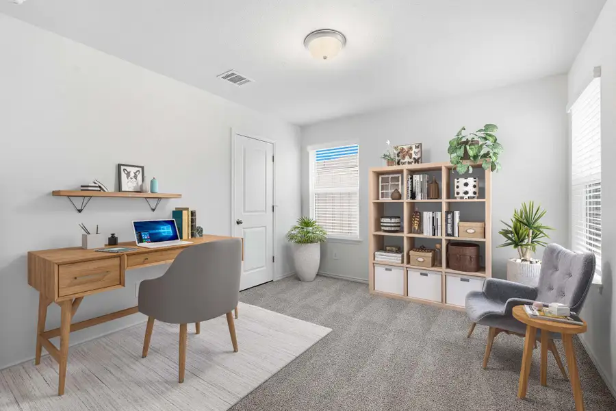 Carpeted room with light-toned walls, ceiling-mounted light fixture, and white trim Carpeted room with light-toned walls, ceiling-mounted light fixture, and white trim