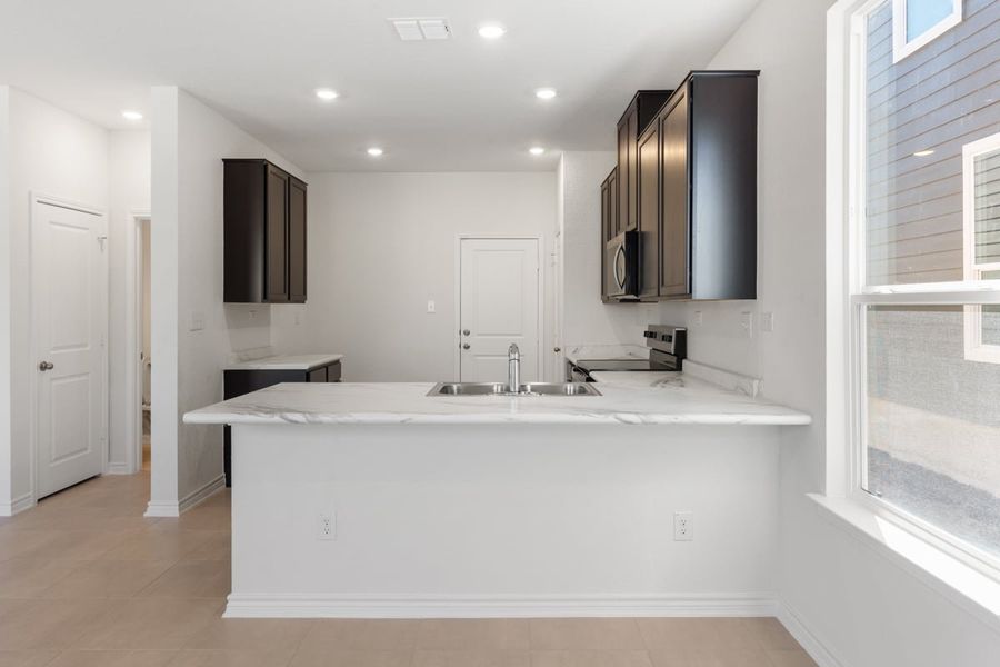 Furnished interior view inside a new home in Spanish Trails Villas, San Antonio (Image 5).