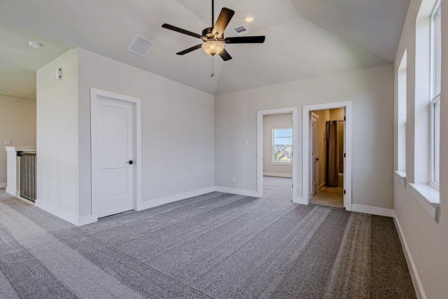 Another view of the versatile upstairs game room and surrounding bedroom access