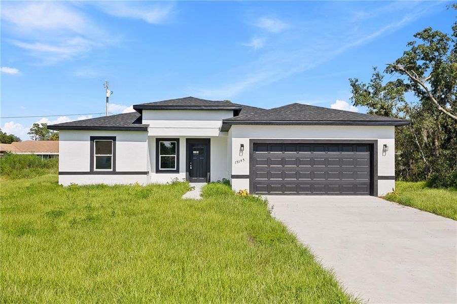 Front exterior of a new home in , Ocala, FL, highlighting curb appeal (Image 2).