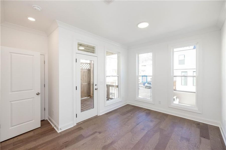 Tucked away behind the kitchen is a spacious sunroom - perfect for a library or home office.