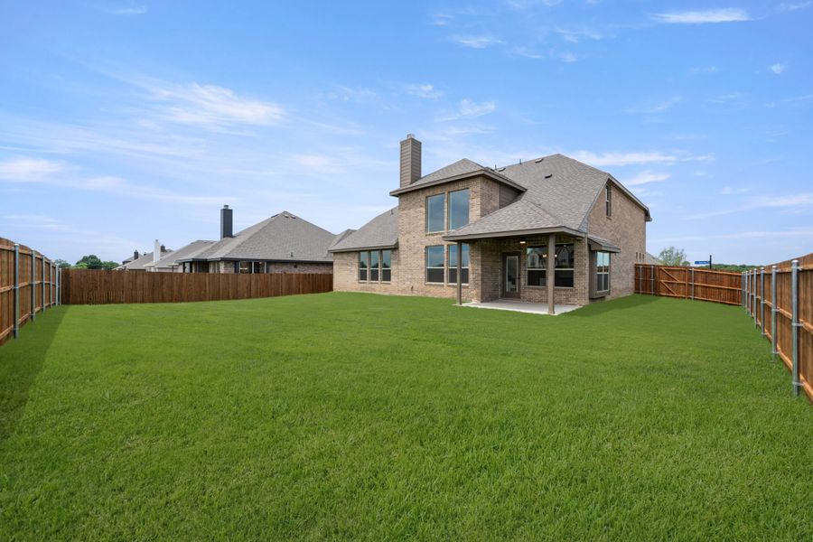 Front exterior of a new home in Mockingbird Hills, Joshua, TX, highlighting curb appeal (Image 29).