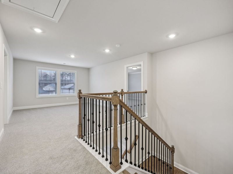 Spacious, unfurnished interior of a new home in Vines at Mill Creek - Estate Series, Braselton (Image 15).