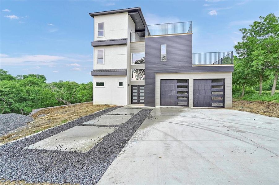 Front exterior of a new home in , Pottsboro, TX, highlighting curb appeal (Image 1).