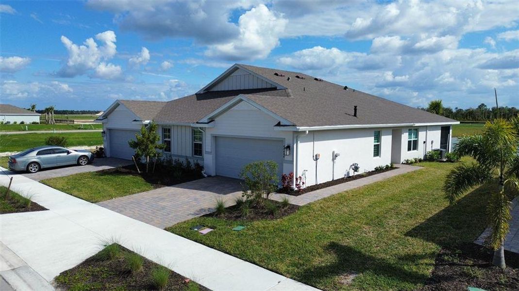 Front exterior of a new home in , Punta Gorda, FL, highlighting curb appeal (Image 21).