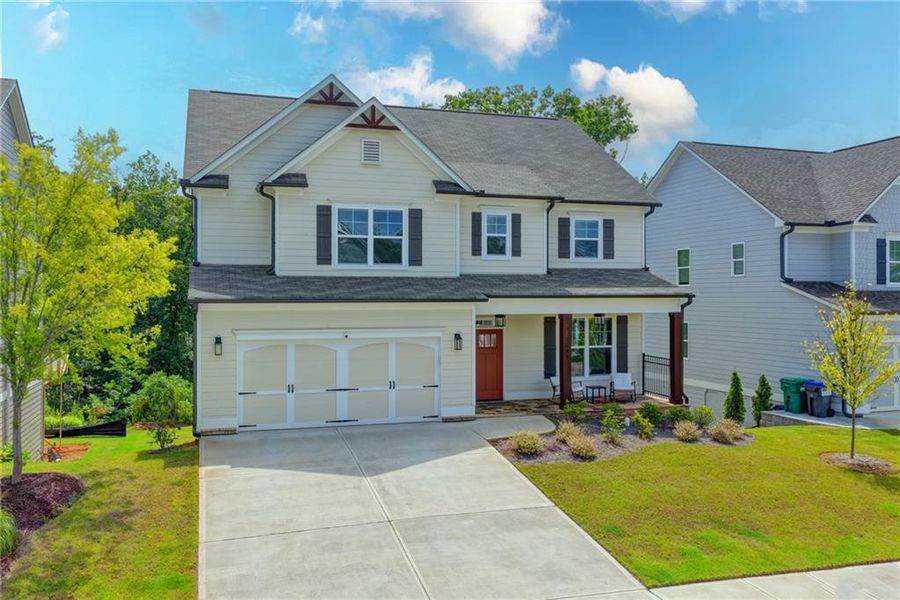 Front exterior of a new home in , Woodstock, GA, highlighting curb appeal (Image 2). Front exterior of a new home in , Woodstock, GA, highlighting curb appeal (Image 2).