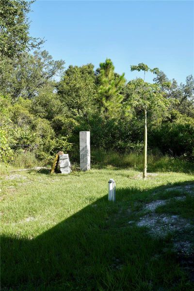 Front exterior of a new home in , Lehigh Acres, FL, highlighting curb appeal (Image 26).