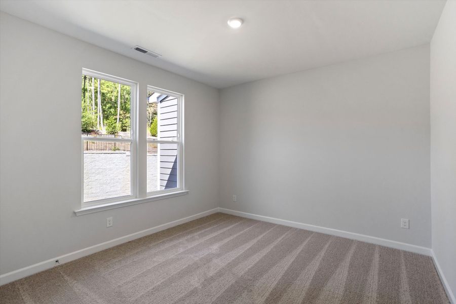 Spacious, unfurnished interior of a new home in Ovation at Sweetbrier, Durham (Image 27).