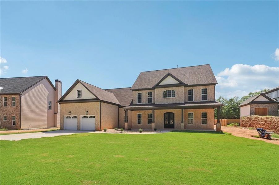 Front exterior of a new home in , Lilburn, GA, highlighting curb appeal (Image 28).