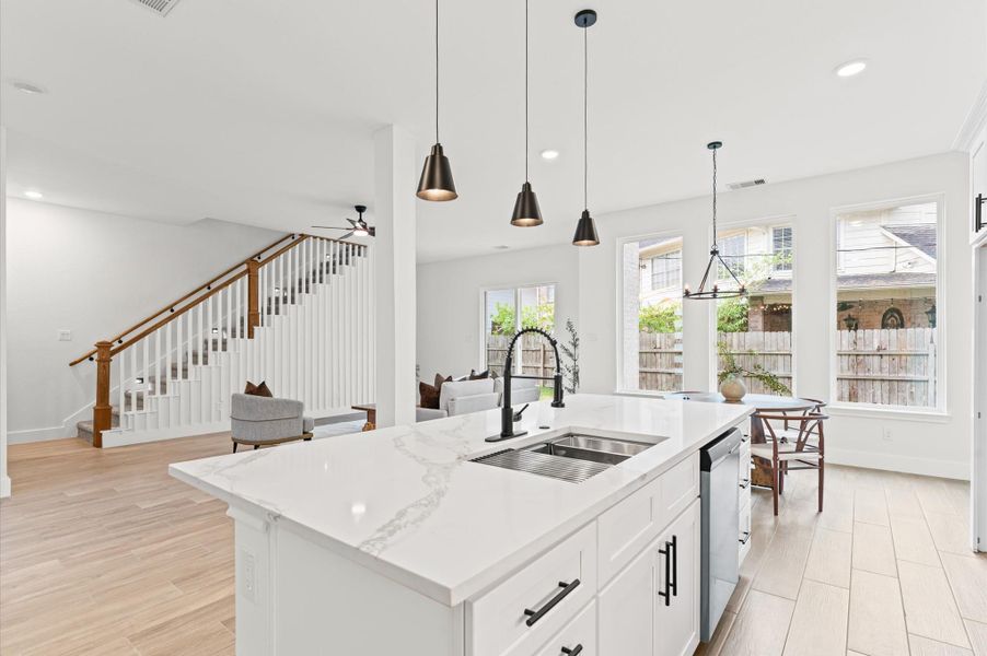 Close-up of the high-end finishes — quartz countertops, custom cabinetry, and sleek fixtures — combining beauty with everyday functionality. Close-up of the high-end finishes — quartz countertops, custom cabinetry, and sleek fixtures — combining beauty with everyday functionality.