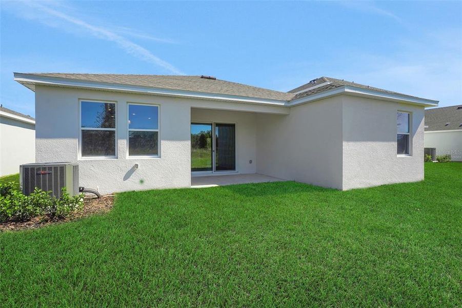 Exterior details and patio area of a home in Willowbrook North, Winter Haven (Image 16).
