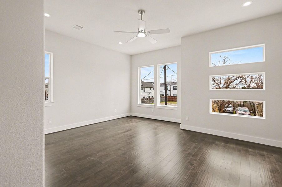 Spacious primary suite filled with natural light and soaring ceilings for a peaceful retreat.