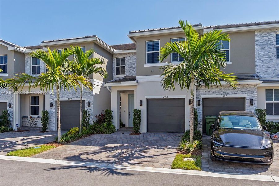 Front exterior of a new home in , Pembroke Pines, FL, highlighting curb appeal (Image 24).