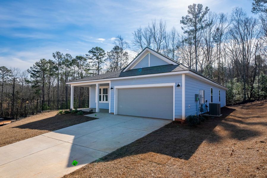 Front exterior of a new home in Carriage Estates, Lexington, SC, highlighting curb appeal (Image 21). Front exterior of a new home in Carriage Estates, Lexington, SC, highlighting curb appeal (Image 21).