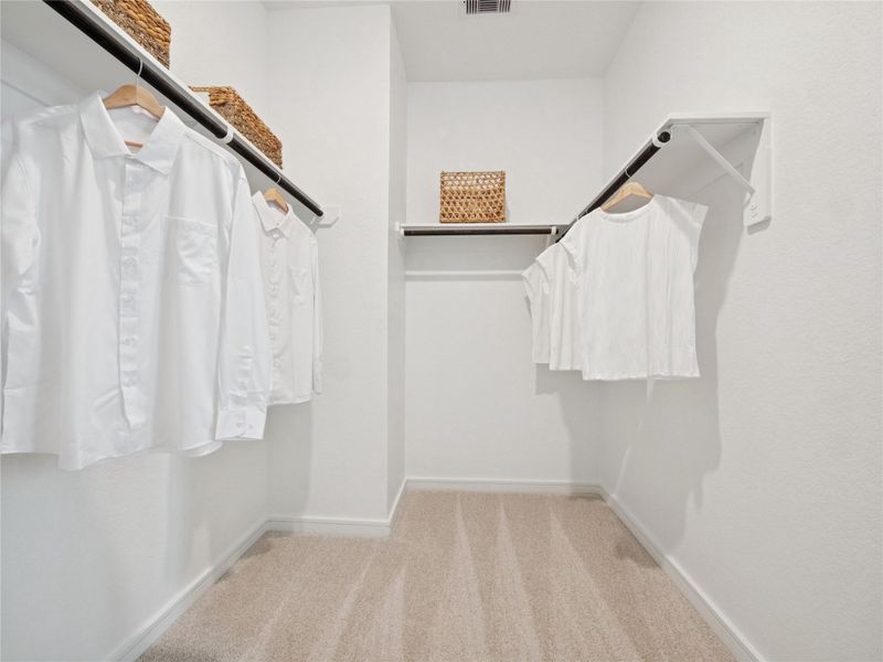 Large closet in the primary suite (*Photo not of actual home and used for illustration purposes only.) Large closet in the primary suite (*Photo not of actual home and used for illustration purposes only.)