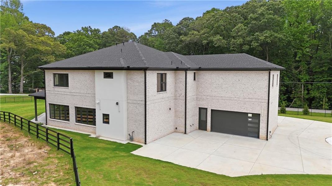 Front exterior of a new home in , Lawrenceville, GA, highlighting curb appeal (Image 1). Front exterior of a new home in , Lawrenceville, GA, highlighting curb appeal (Image 1).