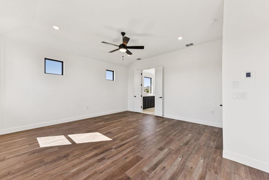 Spare room with recessed lighting, dark wood-style flooring, and a ceiling fan