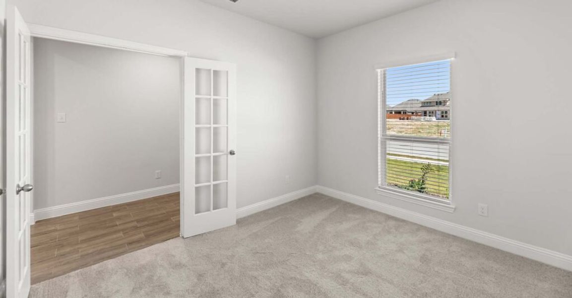 Representative exterior photo of a completed home built from the Goodrich by Impression Homes in Timberbrook, Justin, TX (Image 12).