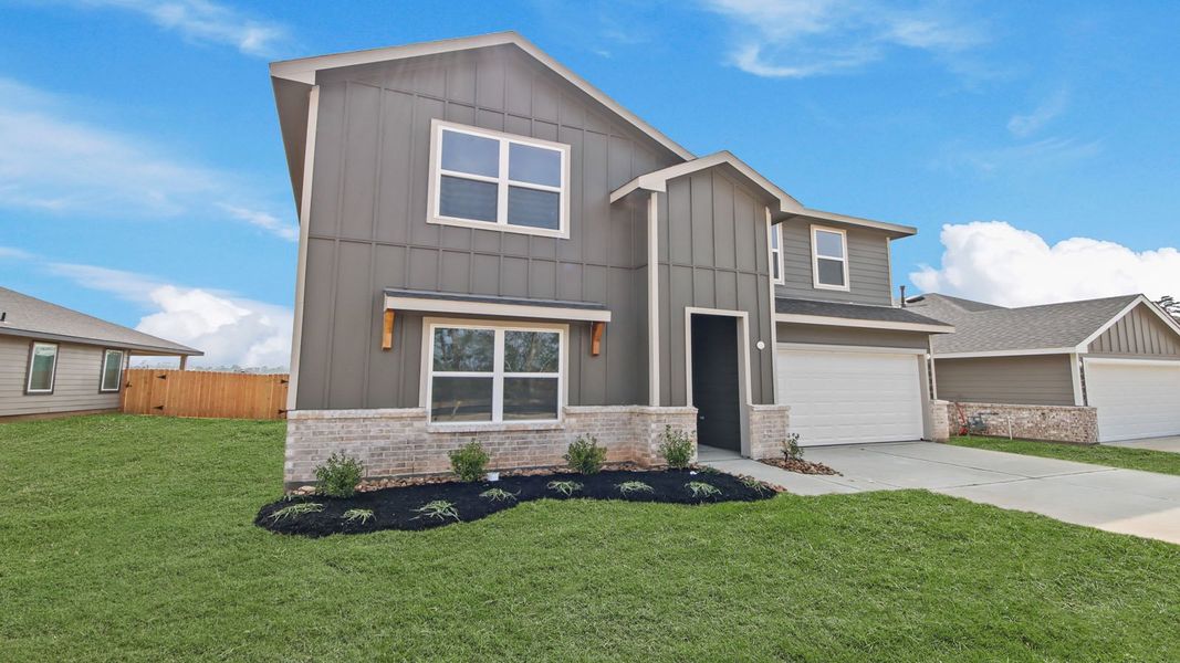 Front exterior of a new home in Chapel Lakes, Montgomery, TX, highlighting curb appeal (Image 16).
