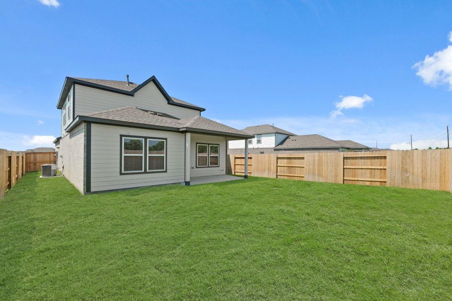 Exterior details and patio area of a home in River Ranch Trails, Dayton (Image 19).
