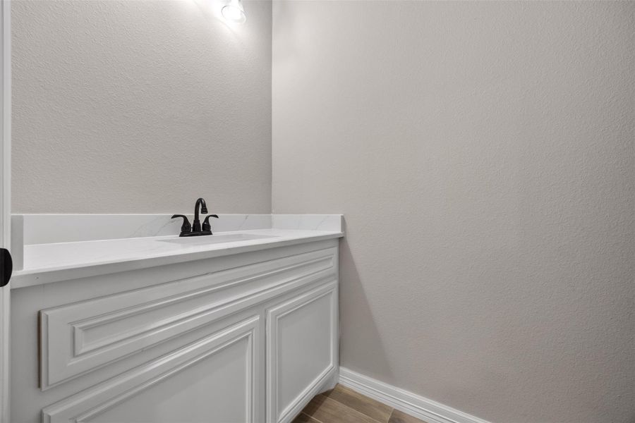 Sample of Home. 1/2 bath off the main hallway