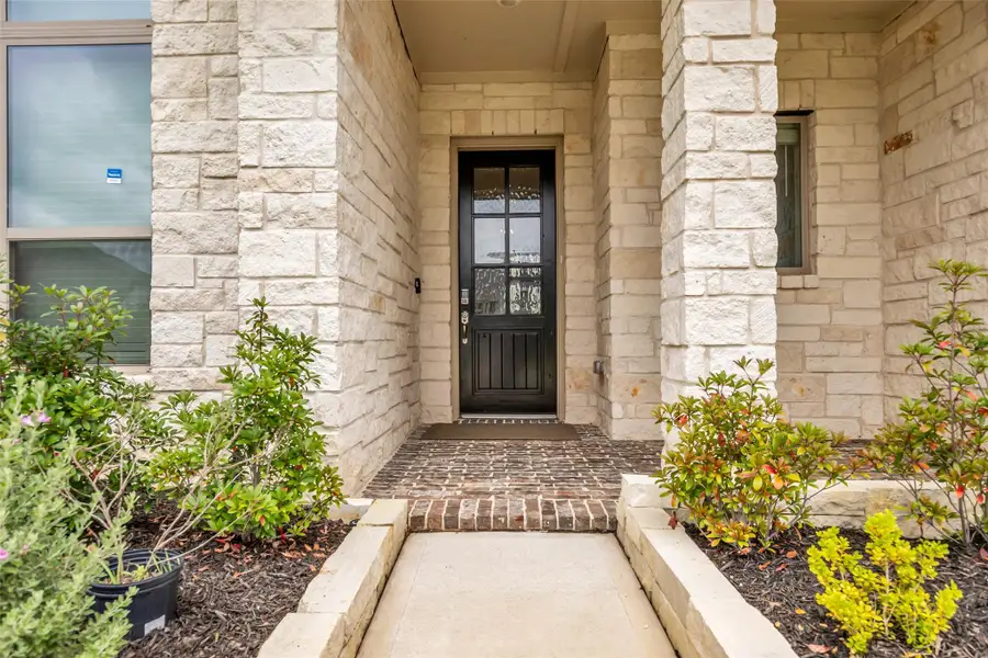 Exterior details and patio area of a home in , Conroe (Image 26).