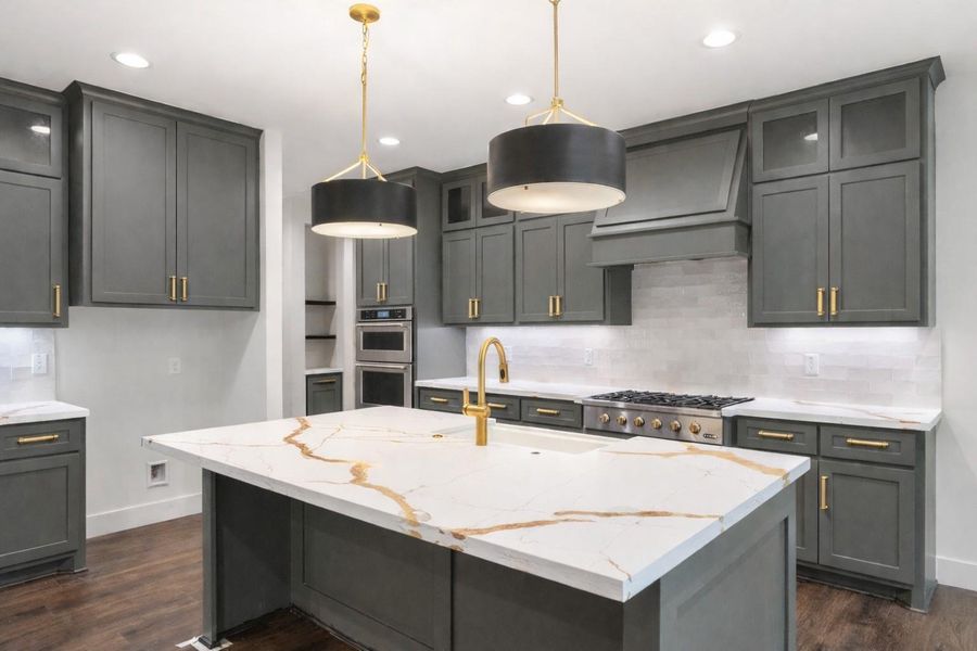 Hardware to be installed. Added digitally. Discover modern elegance in this stylish kitchen featuring sleek cabinetry with gold hardware, a stunning quartz island, and sophisticated pendant lighting, creating the perfect blend of luxury and functionality.