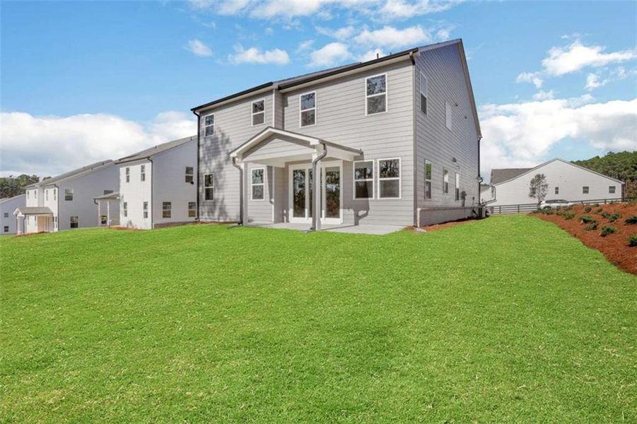 Exterior details and patio area of a home in The Paddocks at Doc Hughes, Buford (Image 3).