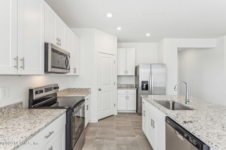 Furnished interior view inside a new home in Lakes at Bella Lago - Signature Series, Green Cove Springs (Image 6). Furnished interior view inside a new home in Lakes at Bella Lago - Signature Series, Green Cove Springs (Image 6).