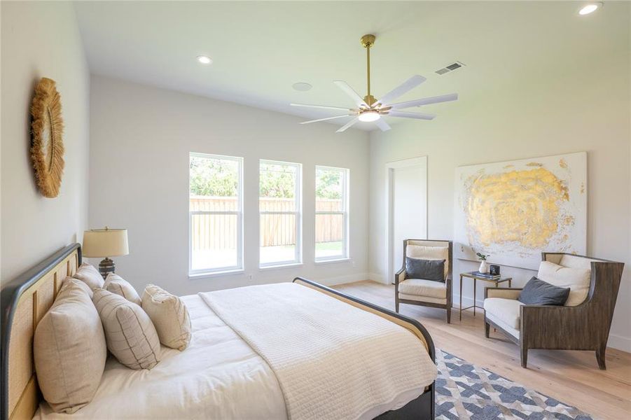 Bedroom featuring ceiling fan and light wood-type flooring