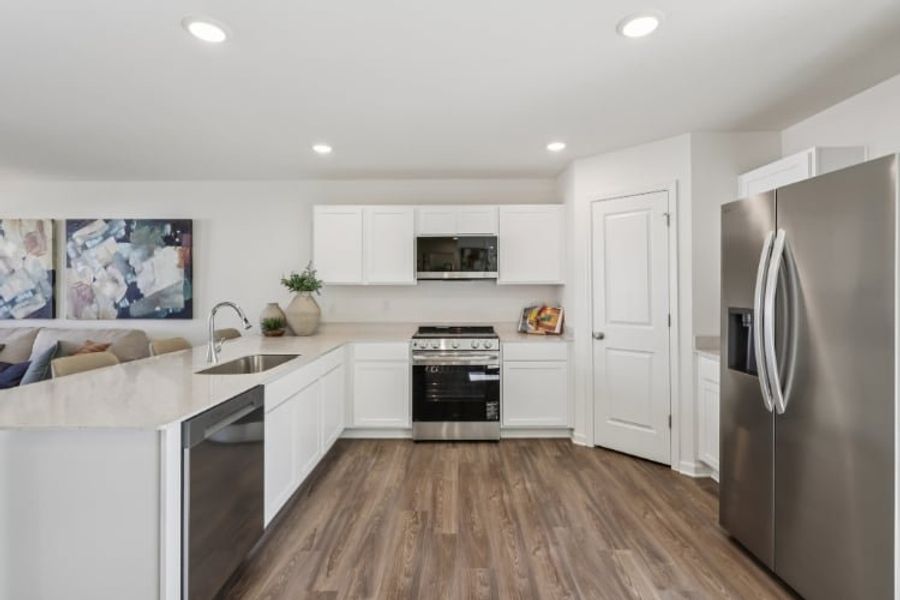 A kitchen with white cabinets. A kitchen with white cabinets.