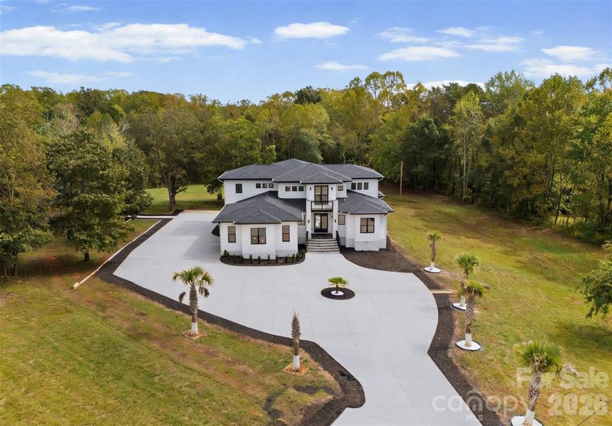 Front exterior of a new home in , Statesville, NC, highlighting curb appeal (Image 22).