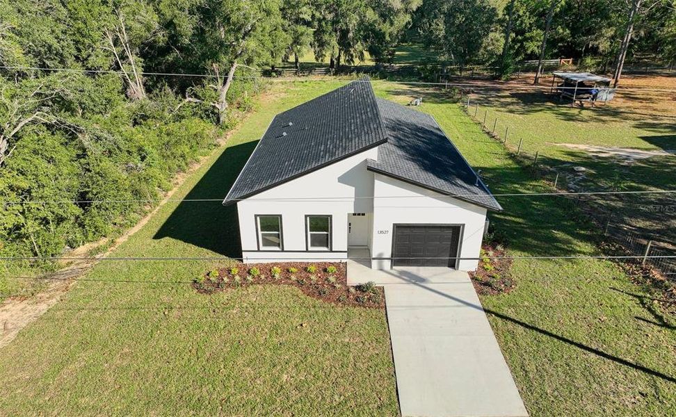 Front exterior of a new home in , Dunnellon, FL, highlighting curb appeal (Image 24).