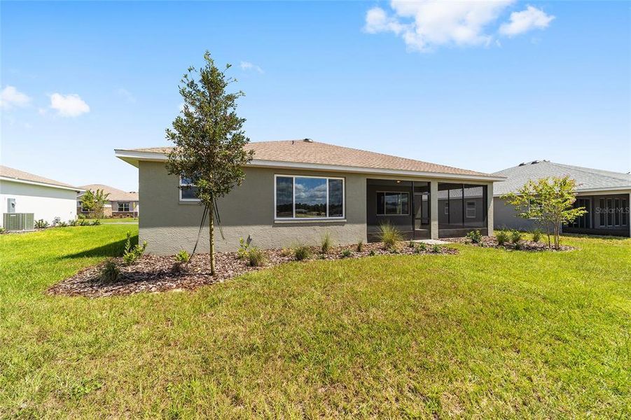 Front exterior of a new home in On Top of the World Communities, Ocala, FL, highlighting curb appeal (Image 22). Front exterior of a new home in On Top of the World Communities, Ocala, FL, highlighting curb appeal (Image 22).