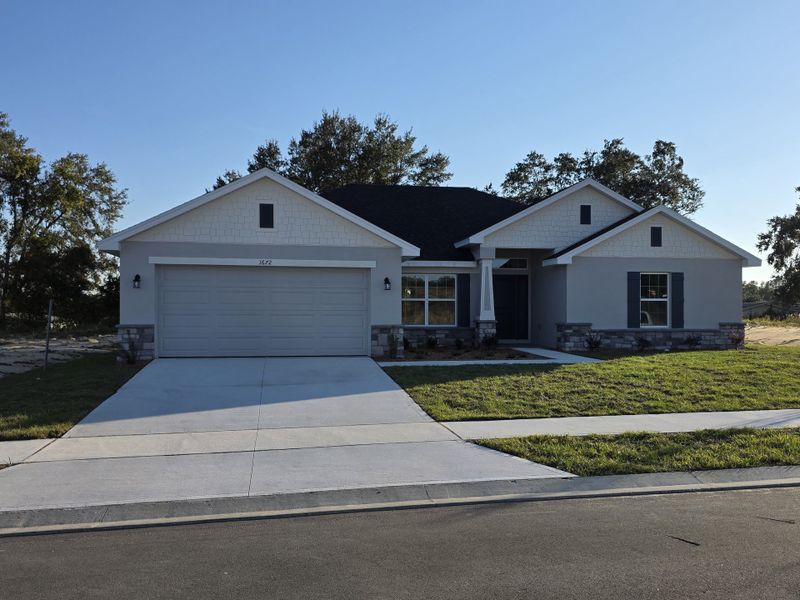 Front exterior of a new home in Arbor Park, Leesburg, FL, highlighting curb appeal (Image 2).