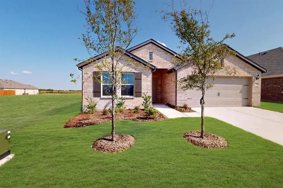 Front exterior of a new home in Verandah, Royse City, TX, highlighting curb appeal (Image 15). Front exterior of a new home in Verandah, Royse City, TX, highlighting curb appeal (Image 15).