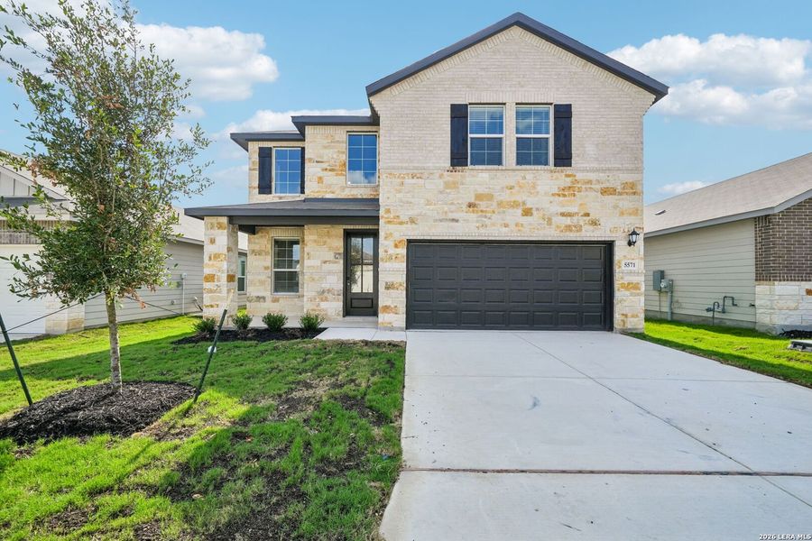 Front exterior of a new home in Thomas Pond, San Antonio, TX, highlighting curb appeal (Image 24). Front exterior of a new home in Thomas Pond, San Antonio, TX, highlighting curb appeal (Image 24).