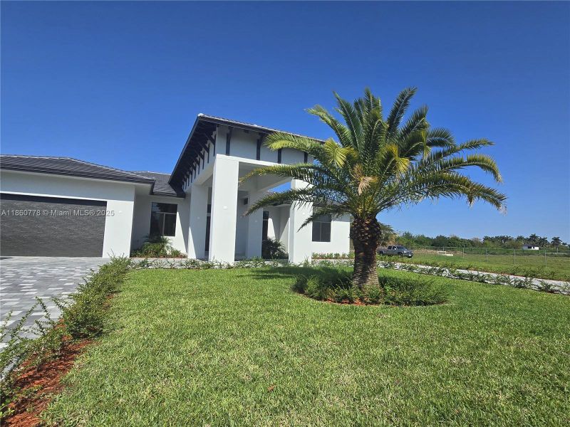 Front exterior of a new home in , Homestead, FL, highlighting curb appeal (Image 33).