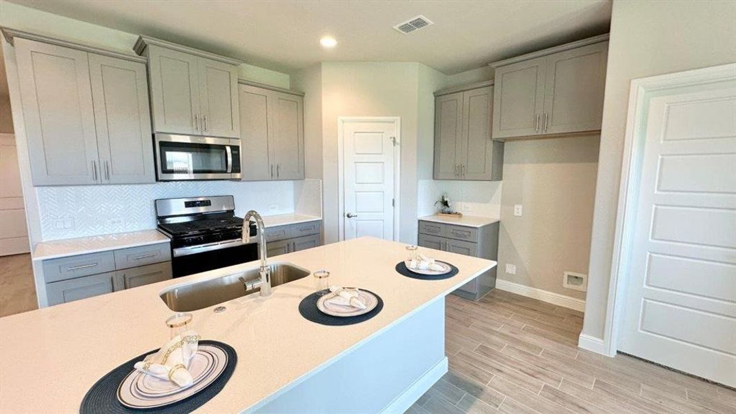 Kitchen - All Home and community information, including pricing, included features, terms, availability and amenities, are subject to change at any time without notice or obligation. All Drawings, pictures, photographs, video, square footages, floor plans, elevations, features, colors and sizes are approximate for illustration purposes only and will vary from the homes as built.