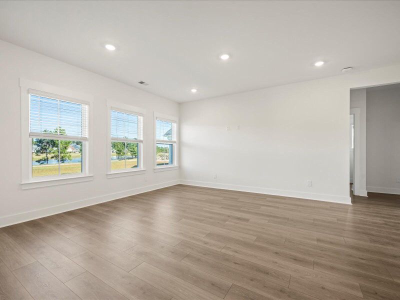 Spacious, unfurnished interior of a new home in The Coves at Lakes of Cane Bay, Summerville (Image 25).