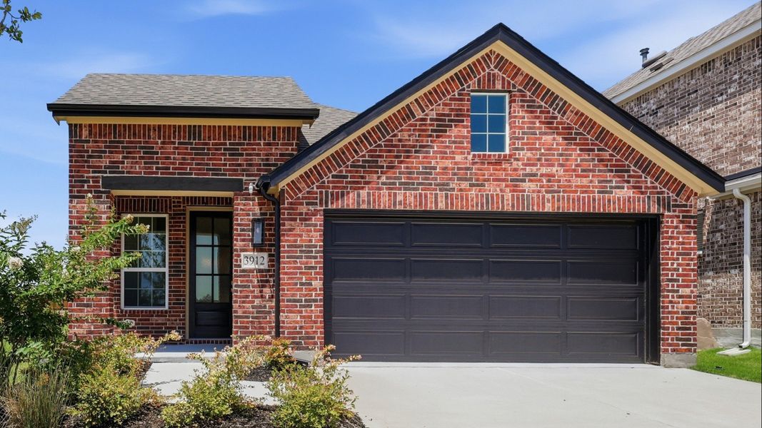 Front exterior of a new home in Bel Air Village, Sherman, TX, highlighting curb appeal (Image 2). Front exterior of a new home in Bel Air Village, Sherman, TX, highlighting curb appeal (Image 2).