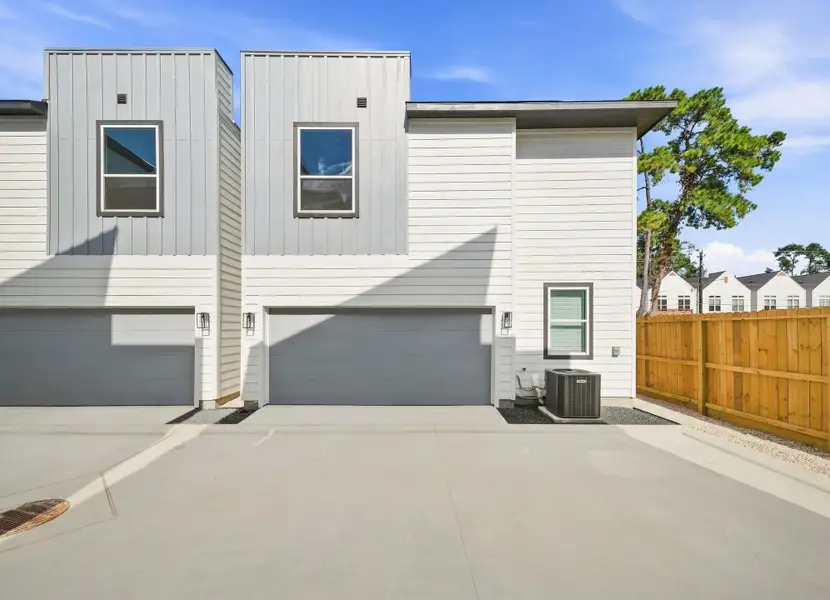 Private internal drive providing convenient access to the rear-entry attached garages, keeping vehicle access within the gated community.