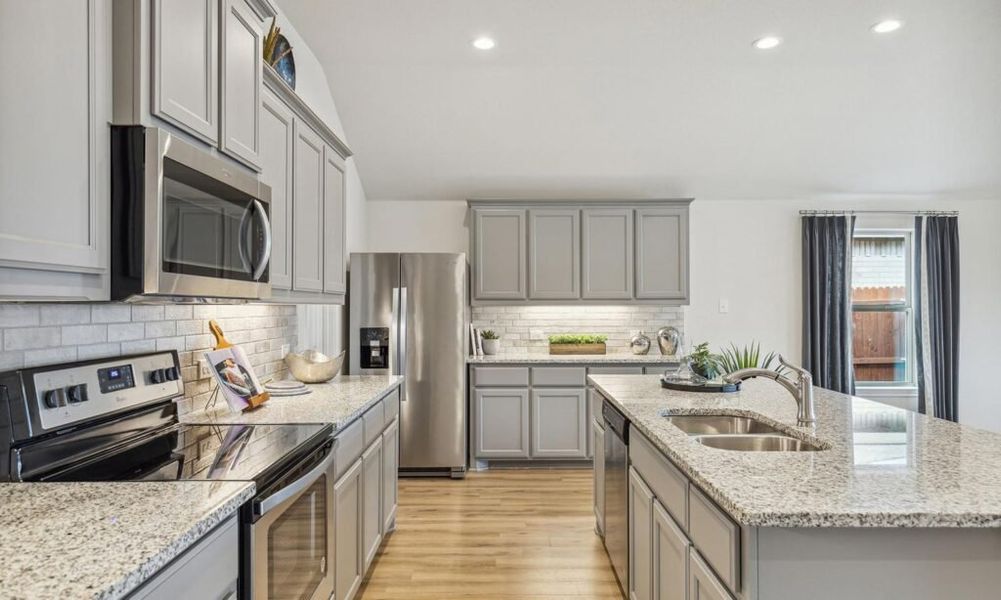 Front exterior of a new home in Rainbow Ridge, Fort Worth, TX, highlighting curb appeal (Image 14). Front exterior of a new home in Rainbow Ridge, Fort Worth, TX, highlighting curb appeal (Image 14).