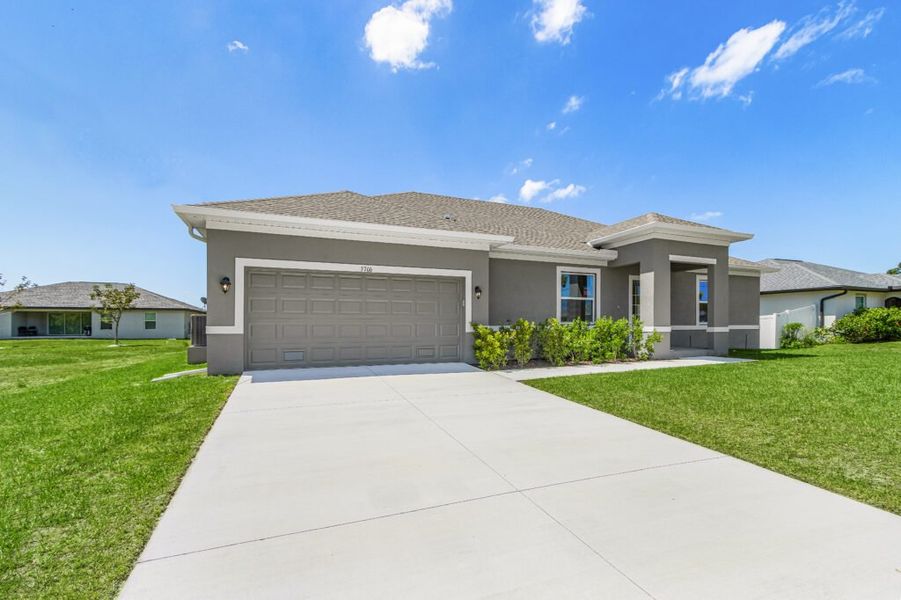 Front exterior of a new home in Cape Coral, Cape Coral, FL, highlighting curb appeal (Image 2). Front exterior of a new home in Cape Coral, Cape Coral, FL, highlighting curb appeal (Image 2).