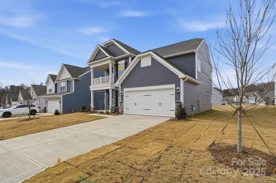 Front exterior of a new home in Carrington, Stanley, NC, highlighting curb appeal (Image 1).