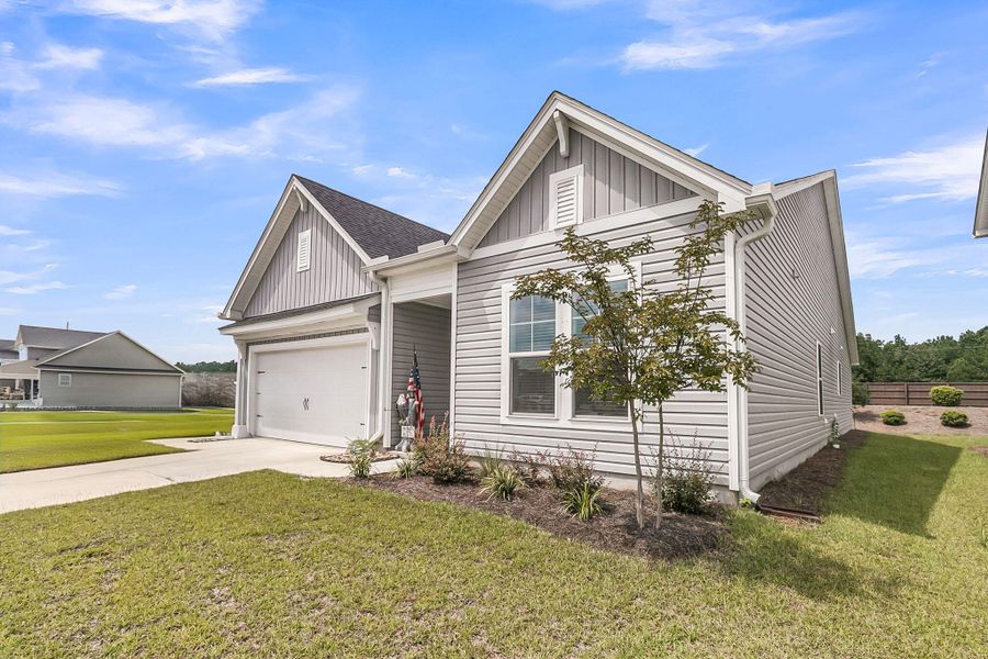 Front exterior of a new home in The Groves of Berkeley, Moncks Corner, SC, highlighting curb appeal (Image 28).